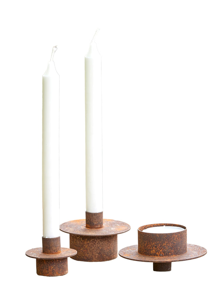 LUCY – Vendbar lysestake i rust